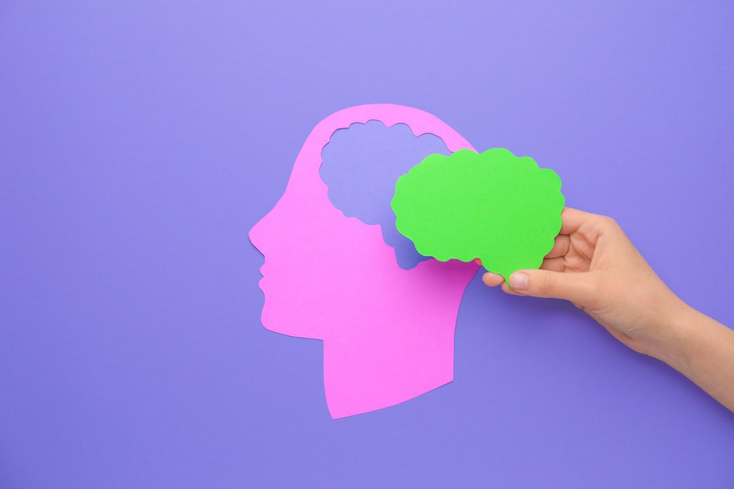C:\Users\Dell\Downloads\female-hand-with-paper-brain-human-head-color-background-neurology-concept.jpg