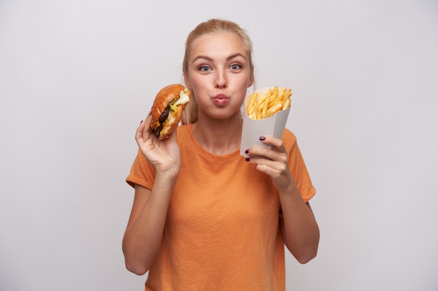 C:UsersDellDownloadsportrait-charming-pretty-young-blonde-woman-holding-junk-food-looking-joyfully-camera-puffing-out-cheeks-being-excited-about-tasty-dinner-isolated-white-background.jpg