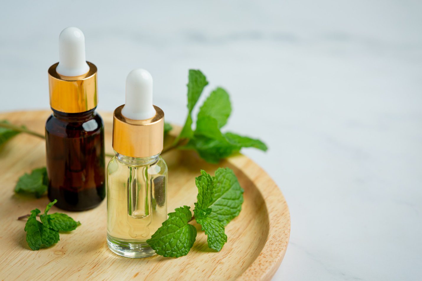 C:\Users\Dell\Downloads\essential-oil-peppermint-bottle-with-fresh-green-peppermint (1).jpg