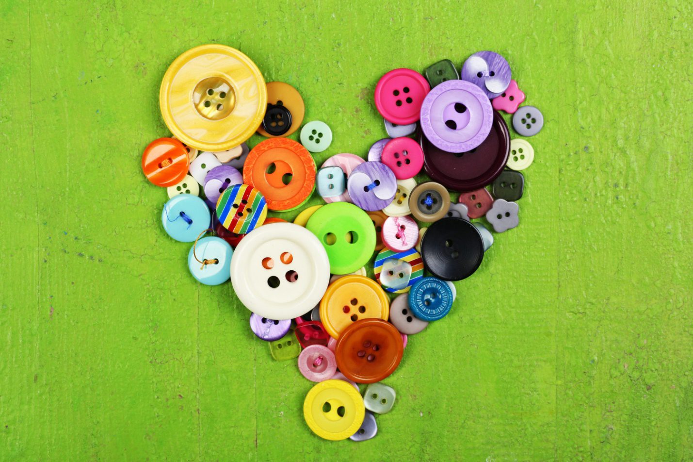 C:\Users\Dell\Downloads\sewing-buttons-heart-wooden-background.jpg