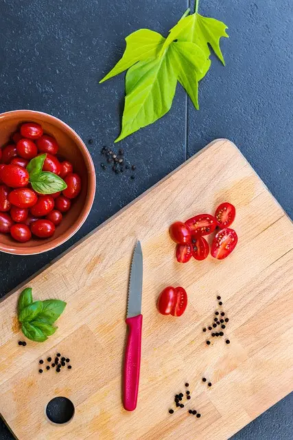 grape tomatoes, organic, cutting board